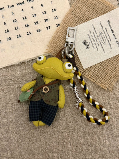 Frog wristlet styled as a bag charm