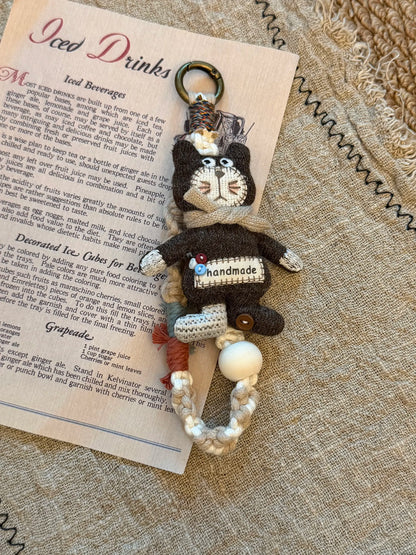 Handmade button cat charm with braided strap