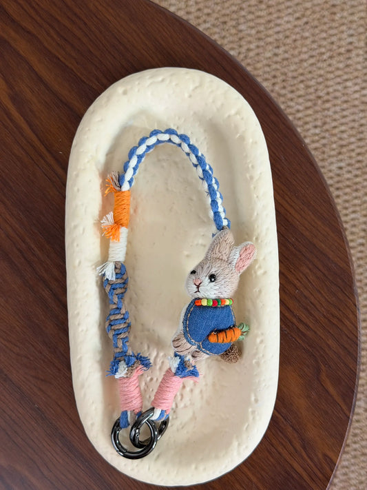 Handmade bunny charm with carrot detail and braided strap
