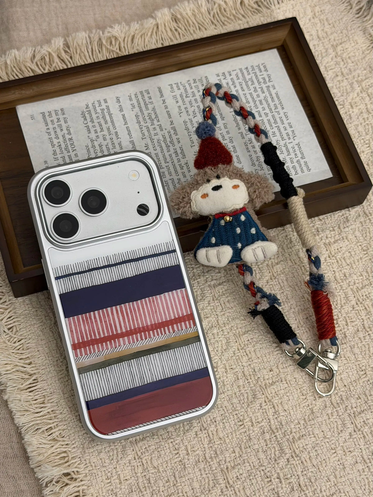 Gray-brown curly-haired puppy phone wristlet