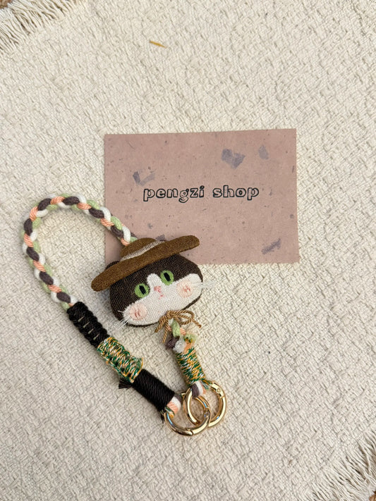 Handmade nomad cat charm with braided strap